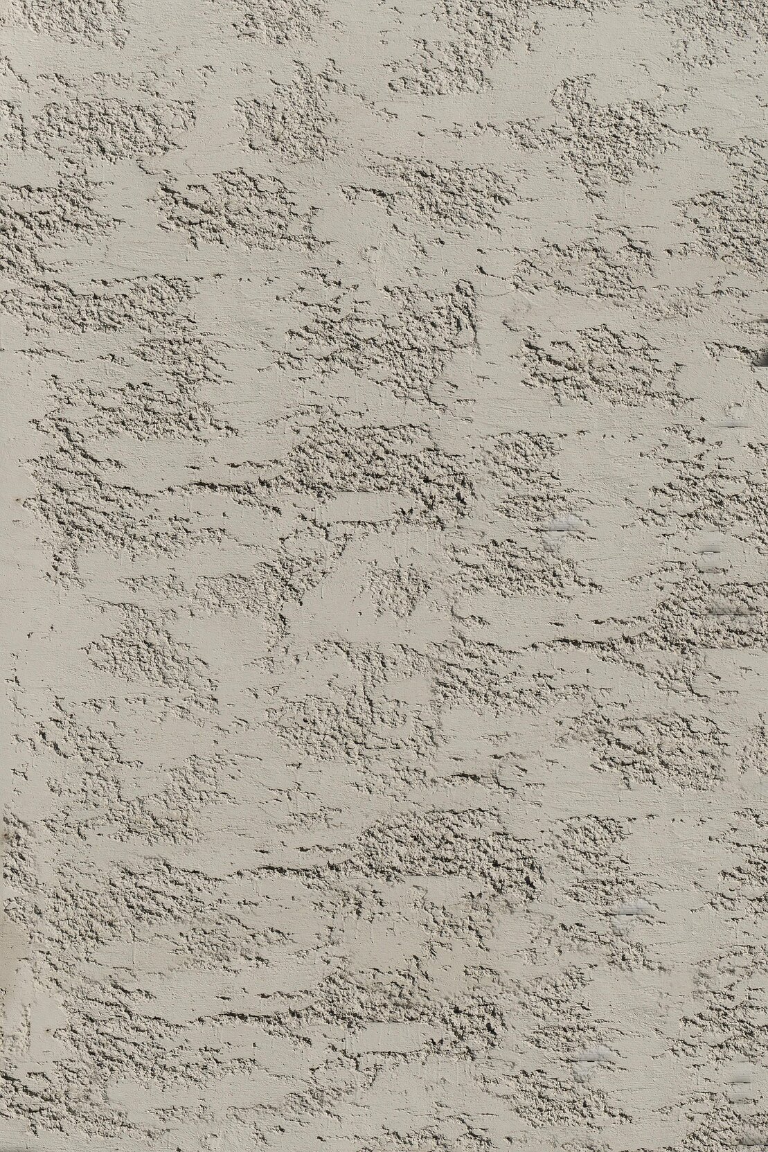 Application d’un enduit de façade à la taloche